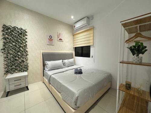 Giường trong phòng chung tại Ipoh Waterpark Manhattan Premium Suites by IWH Suites