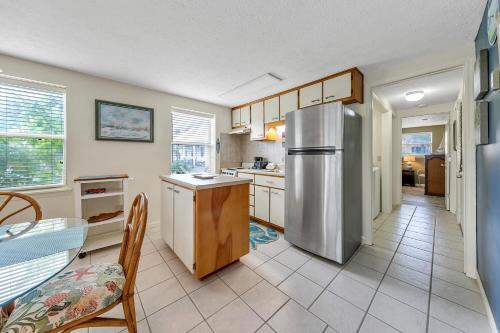 a kitchen with a stainless steel refrigerator in it at Beach Haven by Emerald Coast Retreats in Panama City Beach