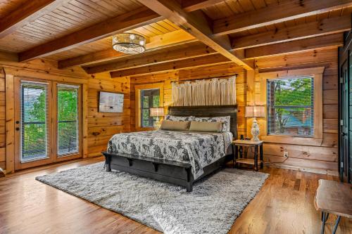 a bedroom with a bed in a room with wooden walls at Dawns View in Sevierville