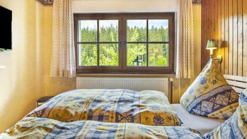 Tempat tidur dalam kamar di Schwarzwaldliebe