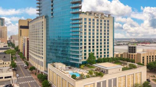 an aerial view of a large glass building at Omni Fort Worth Hotel in Fort Worth