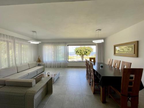 a living room with a table and a couch at Beach spot in Riambel