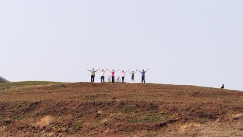 a group of people standing on top of a hill at The Wai Hills MTDC Approved in Wai