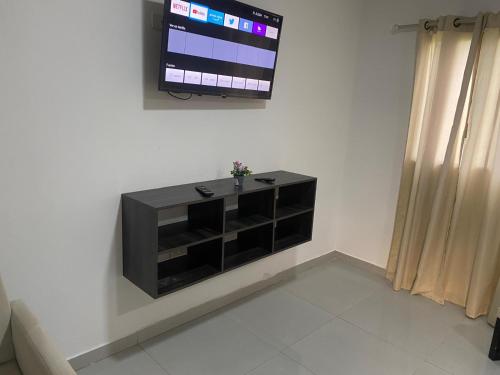 Pacific Stone Apartamentoにあるテレビまたはエンターテインメントセンター