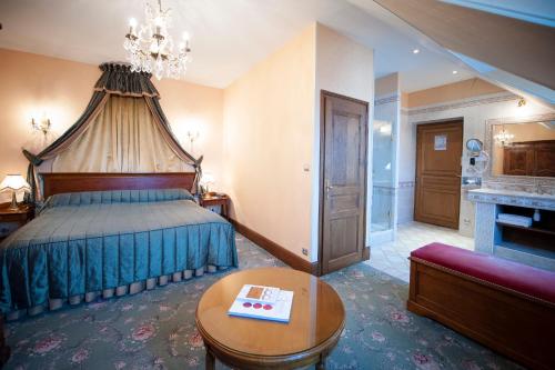 Hôtel Le Cep & Spaにあるベッド