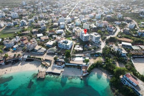 an aerial view of a city with a beach at Hotel Meta Ksamil in Ksamil