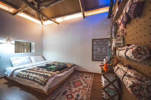 a bedroom with a large bed and a bunk bed at Pet-friendly camping theme house anseongcamp96 by dazayo in Seogwipo