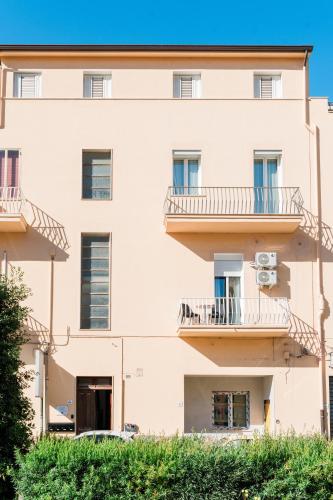 an external view of a building with balconies at FG Vacanze in Alghero