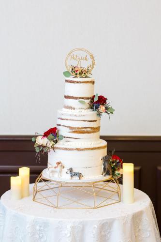a wedding cake sitting on top of a table at Hotel Contessa - Suites on the Riverwalk in San Antonio