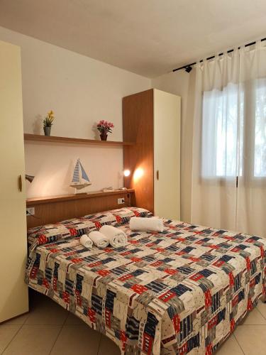 Postel nebo postele na pokoji v ubytování Pineta Azzurra