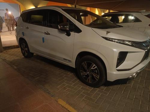 a white car is parked on a street at New Marina Hurghada Suite in Hurghada