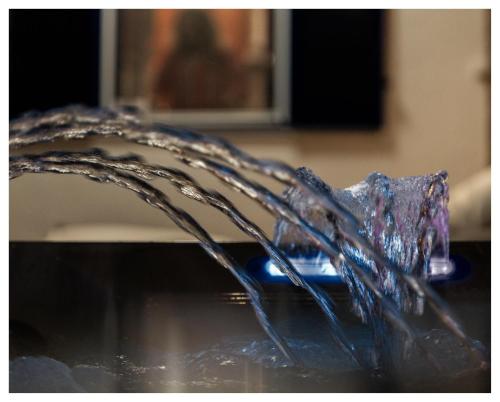 a stream of water coming out of a sink at Varkospito in Ierápetra