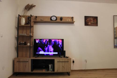 Televisor o centre d'entreteniment de Una apartment