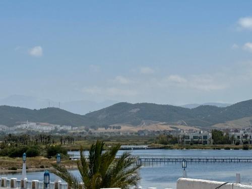 a view of a lake with mountains in the background at Kabila Plag in Tetouan