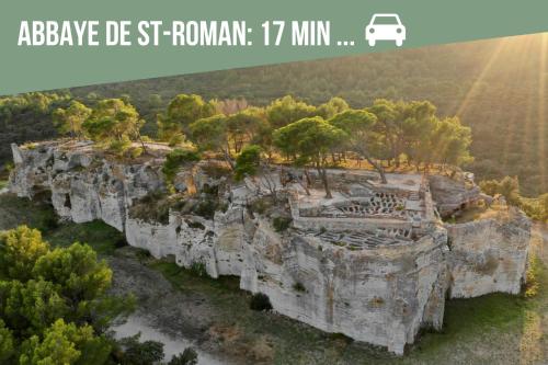 an image of a rock formation with the text abbey de st rounijah at * * * Donjon du Bijoutier * * * Wifi+Clim+Terrasse in Beaucaire