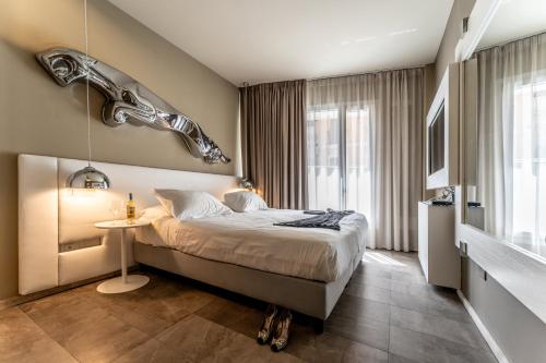 Postel nebo postele na pokoji v ubytování Neko Boutique Hotel