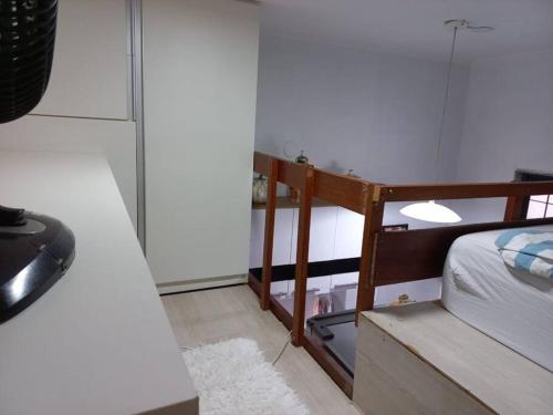 Ein Bett oder Betten in einem Zimmer der Unterkunft Loft Maior Aconchegante