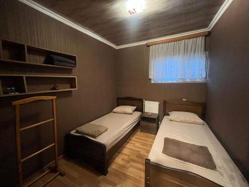 Postel nebo postele na pokoji v ubytování Nano Guest House