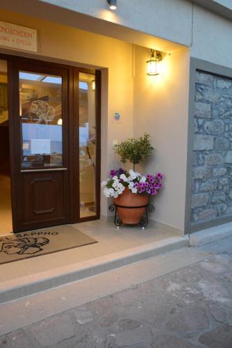 a plant in a pot sitting outside of a building at Sappho Hotel in Skala Eresou