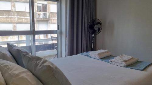 Postel nebo postele na pokoji v ubytování Oporto Downtown