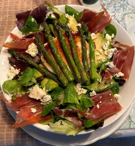 a plate of food with a salad on a table at De Snoeperij in Dirksland