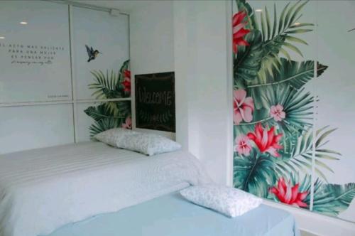 a bedroom with a bed with a poster on the wall at Suite de huéspedes, con alberca in Cuautitlán Izcalli