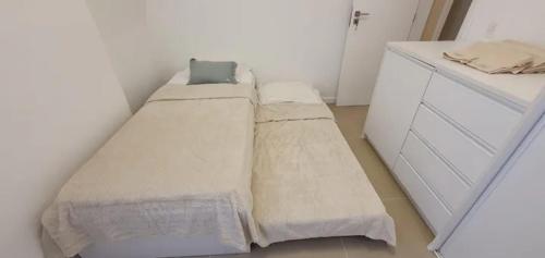 Ένα ή περισσότερα κρεβάτια σε δωμάτιο στο Apartamento em frente à Praia da Barra da Tijuca