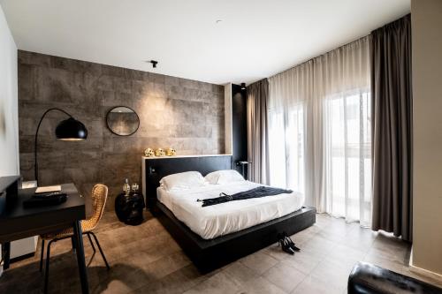 Postel nebo postele na pokoji v ubytování Neko Boutique Hotel