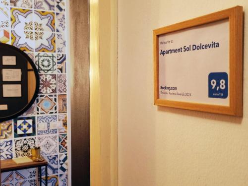a picture of a sign on a wall with tiles at Apartment Sol Dolcevita in Njivice