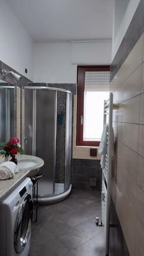 a bathroom with a shower and a sink at appartamento V&V in Abbiategrasso