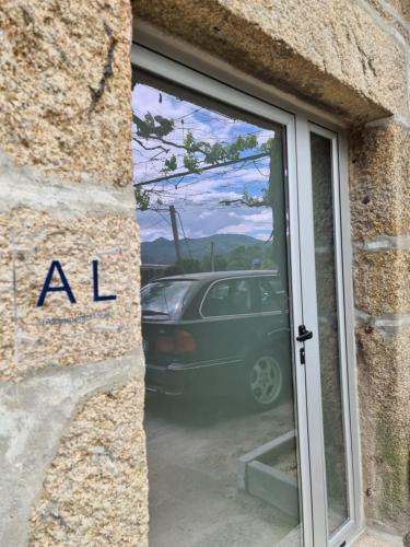 a car parked in a window of a building at Casa Maria da Eira in Arcos de Valdevez