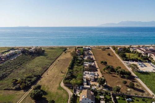 an aerial view of a parking lot next to the ocean at Sirios in Acharavi