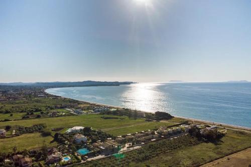 an aerial view of a beach and the ocean at Sirios in Acharavi