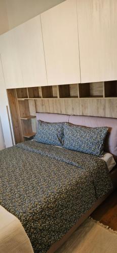 Ένα ή περισσότερα κρεβάτια σε δωμάτιο στο Lago Blue Apartment