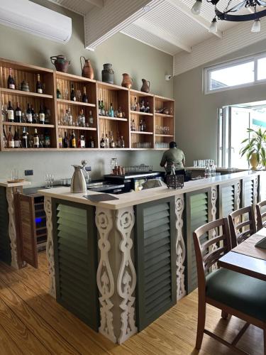 a kitchen with a large island with a counter top at HADCO Experiences at Asa Wright Nature Centre in Blanchisseuse