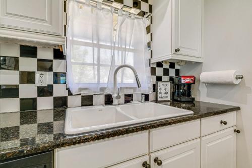 a kitchen with a sink and a window at Screened Lanai and Heated Pool Spring Hill Home in Spring Hill