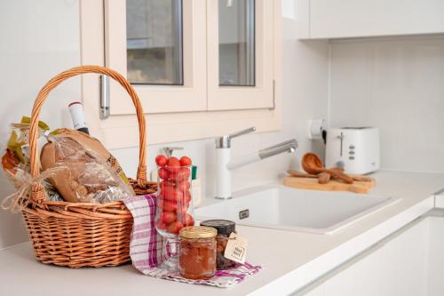 a basket sitting on a kitchen counter next to a sink at SeaView Apartment 1 in Samos