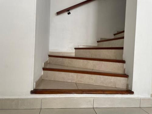 a set of concrete stairs in a white room at Mar y Asados - Chalet hasta 19 huéspedes con dos Parrillas in Mar del Plata