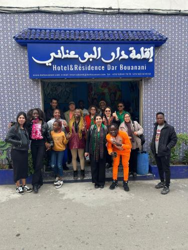 a group of people standing in front of a building at Dar Bouanani in Asilah