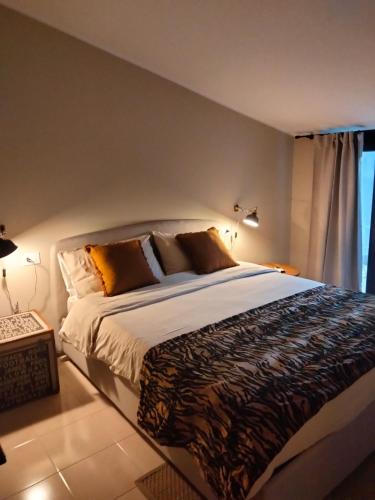a bedroom with a large bed and a window at Rota's House III in Bergamo
