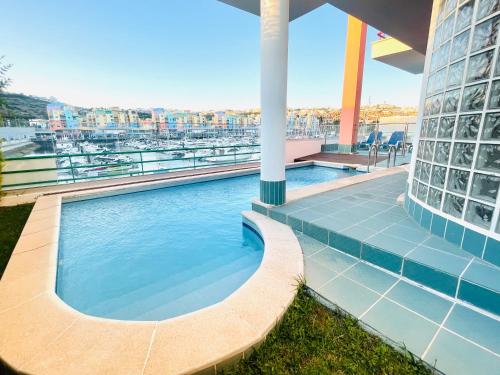 a swimming pool on the roof of a building at Vila D'Alba - Sem Stress in Albufeira
