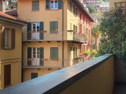 a view of a building with a balcony at Coloniola Lake House in Como