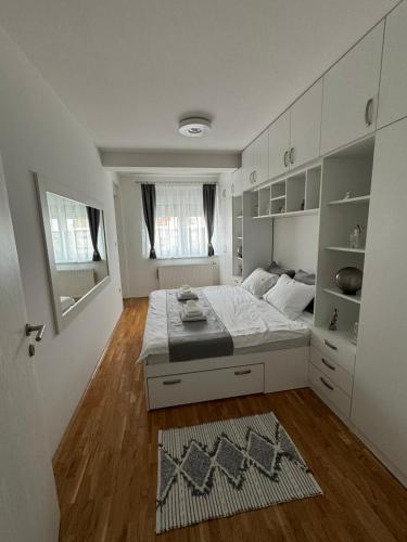 Postel nebo postele na pokoji v ubytování Bulevar Residence