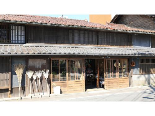 a store front of a building with wooden doors at KITA HOTEL - Vacation STAY 69750v in Morioka