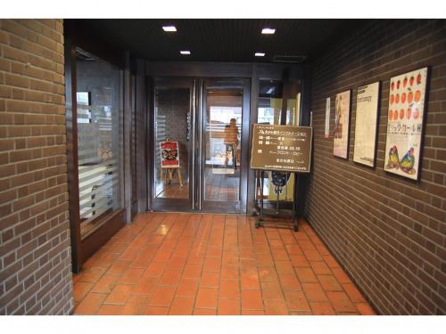 an entrance to a building with a sign in the hallway at KITA HOTEL - Vacation STAY 69748v in Morioka