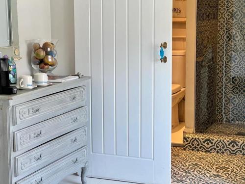 a white dresser in a room with a drawer at The Nook at Blue Door Barns in Beddingham