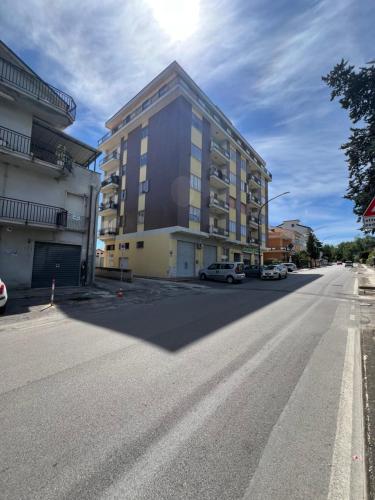 an empty street with a building on the side of a road at Il Momento in Lanciano