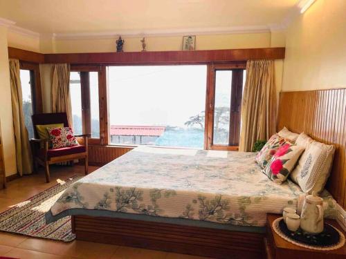Ένα ή περισσότερα κρεβάτια σε δωμάτιο στο Kusum Villa