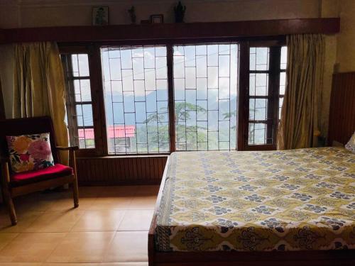 Ένα ή περισσότερα κρεβάτια σε δωμάτιο στο Kusum Villa