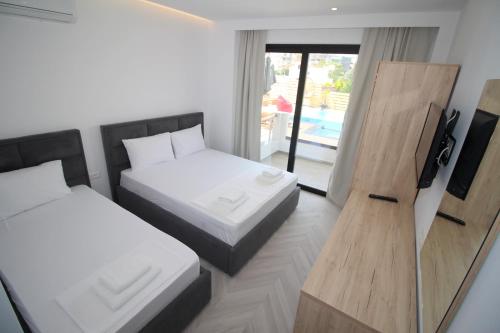 Postel nebo postele na pokoji v ubytování Noa Boutique Hotel
